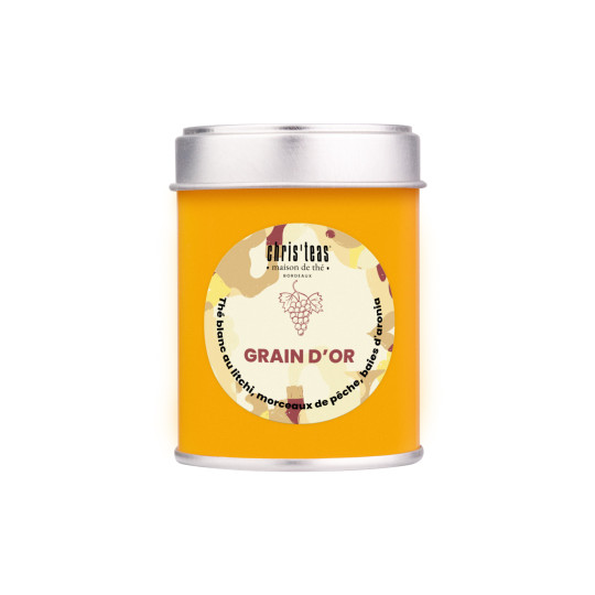 Boite découverte de 25g du thé Grain d'Or, un thé blanc au litchi, morceaux de pêche, et baies d'aronia